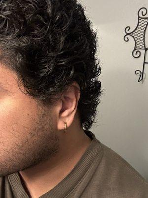 Trim, styling, and consultation for growing out curly hair.