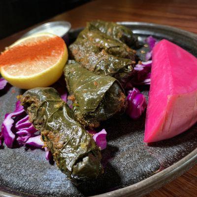 Dolmeh (Vegan): Grape Leaves filled w/ Seasoned Vegetables & Rice.