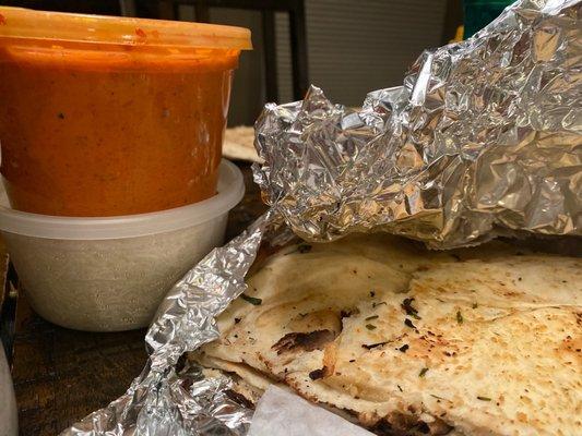 Butter Chicken, Basmati Rice (comes with entree) and garlic naan.