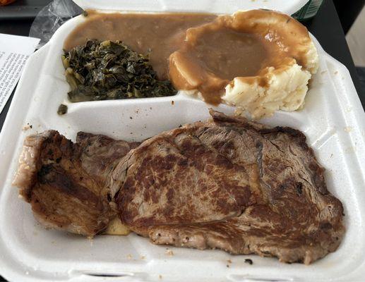 Overcooked grilled ribeye with chef's choice of veggie (collard greens) and mashed potatoes