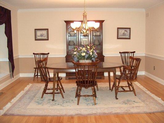 AFTER: Neutral paint, inexpensive window treatment & light fixture, and turning the area rug & furniture made a dramatic difference!