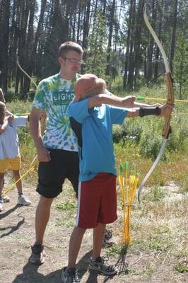 Learning archery at CCO.