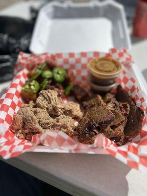 Burnt ends with jalapeño slices , pulled pork, and  brisket