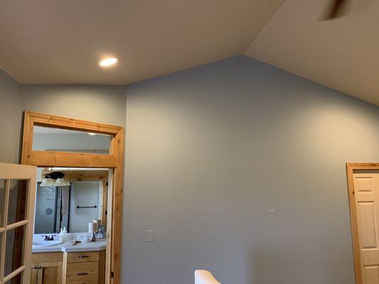 Freshly painted blue walls with vaulted ceilings.