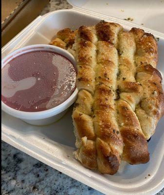 Bread sticks with a garlic butter and a side of marinara