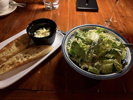 Caesar salad and bread accompaniments to entrees