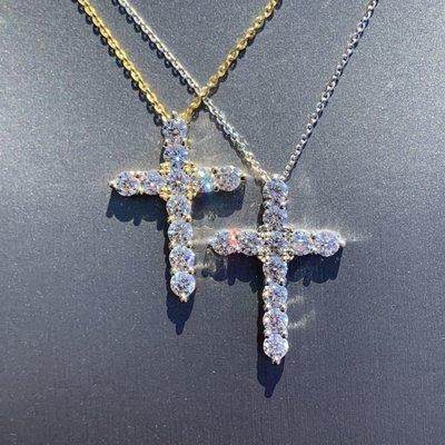 Ladies diamond crosses available in several sizes and colors