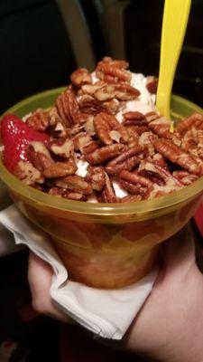 Strawberry shortcake sundae with pecans.