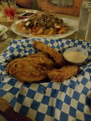 Deep fried pickles backed with nachos