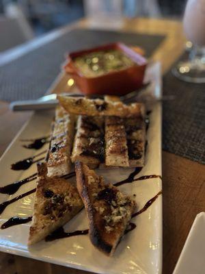 Burrata and garlic sauce with toasted bread