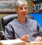 Dr. Radakovich at his desk