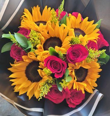 Roses and sunflowers bouquet 
Www.floristnorwalk.com