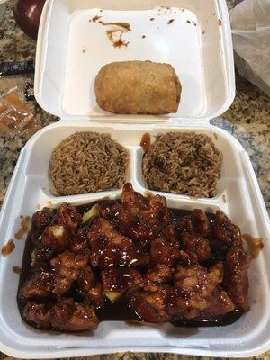 Orange chicken combo plate with rice fried an egg roll shrimp