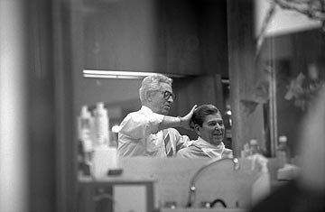 Ronald Reagan getting a haircut at our original Beverly Hills location.