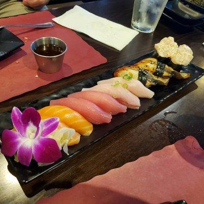 Salmon, yellowtail, Escolar, eel, and scallop.