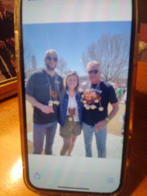 Me on the right, son in law and daughter. Those are dips attached to the necklace by strings. Beercheese, mustard and nacho cheese.