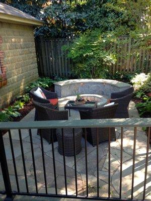 Small backyard Living Area.  Annapolis Firepit, Bench seating wall, irregular flagstone patio, outdoor lighting