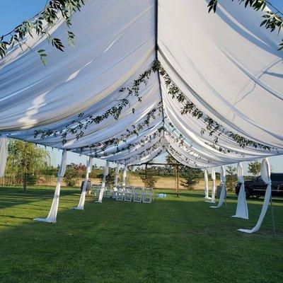 White draping with greenery no tarp