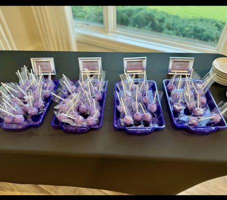 Cake pops with purple frosting.