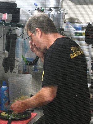 Eating with his fingers then served customers food