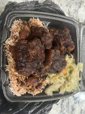 Delivery- Large size Oxtail stew with cabbage and rice & beans.  Yum!