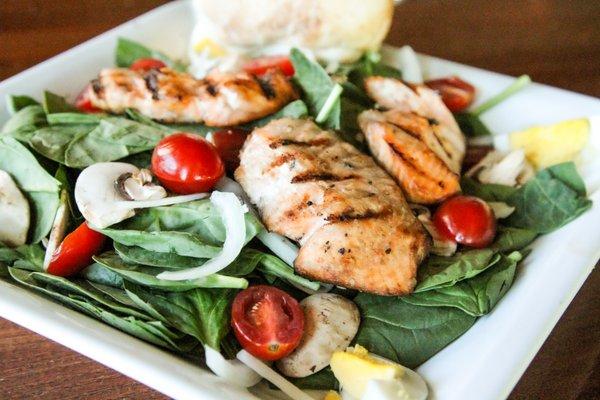 Salmon & Spinach Salad on Wheatstack's menu, located in the clubhouse at the golf course.