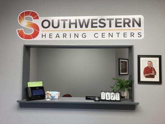 Reception area staffed by patient care coordinator.