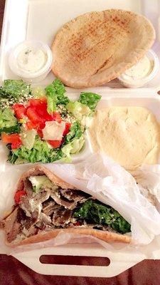 Gyro on wheat with hummus and wheat pits bread with Greek feta salad.