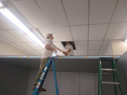 Our dedicated technicians working on a commercial walk-in freezer installation.