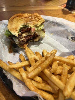 Rare cheeseburger with Swiss cheese and sautéed onions.  Juicy and delicious!  Accompanied by perfect fries.