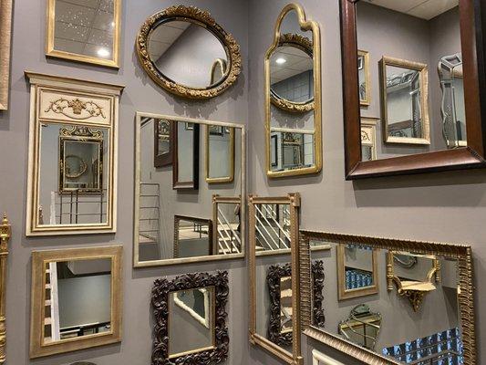 A collection of mirrors and frames available in our showroom for purchase.