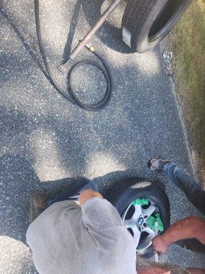 Mounting my tire on the side of the road.