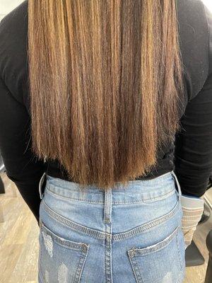 This was at our family friends salon, she straightened my sisters hair to see how uneven her cute was when she came in.