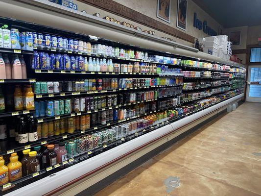 Array of beverages from juices to cold beer.