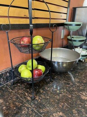 4-2022 breakfast area - fresh fruit  water and apple juice in ice on the side.