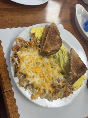 Meat lovers omelette with cheesy hash browns. So delicious!