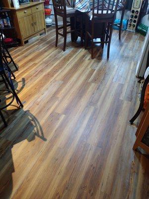 New plank flooring in the dining room.