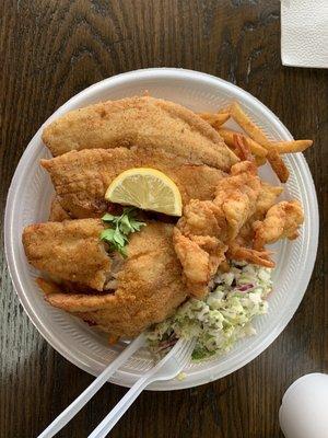 Fry shrimp and tilapia served over fries and coleslaw salad.