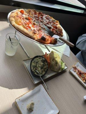 Delicious spinach and artichoke dip!  Pizza crust is light and airy with just the right amount of crunch!