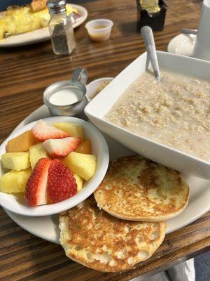 Oatmeal, brown sugar & milk with fresh fruit and toasted English muffin.