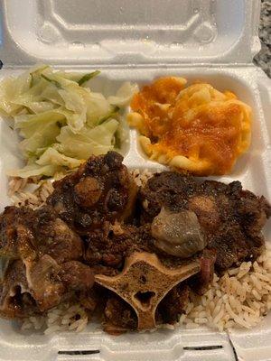 Oxtails Mac n cheese white rice and cabbage