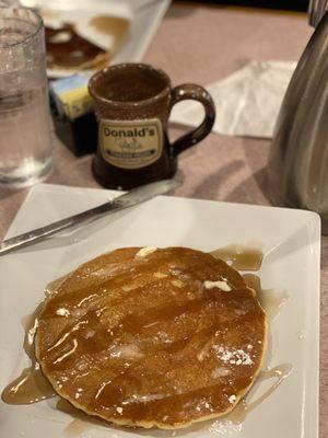 Pancake with powdered sugar and syrup