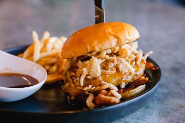 Cowboy Burger, Cheddar Jack, Jack Daniels sauce, bacon, romaine, tomato, crispy onion straws.