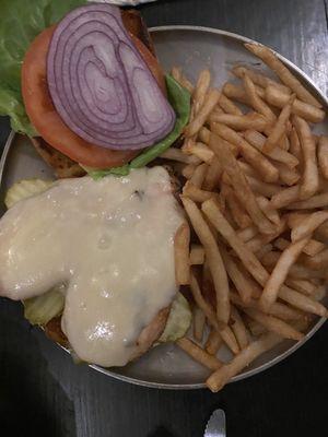 Grilled chicken with swiss cheese lettuce and tomato on a brioche bun.