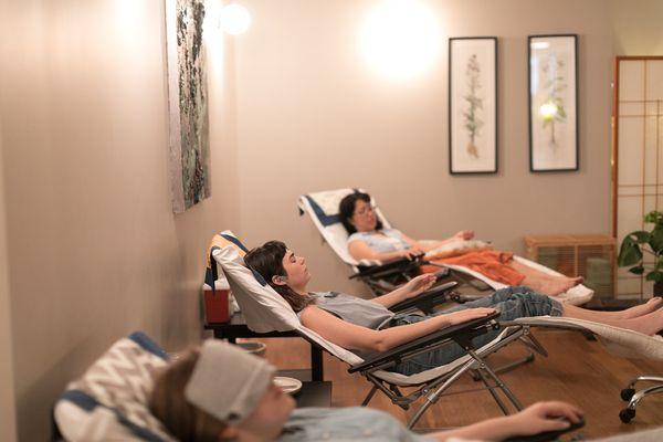 Patients relaxing during acupuncture sessions in the Community room