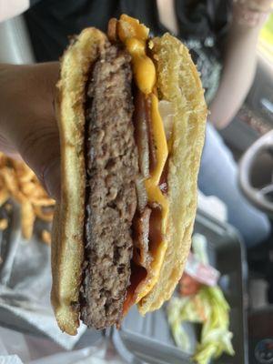 Very Dry Bacon Cheeseburger  that may identify as a Hockey Puck