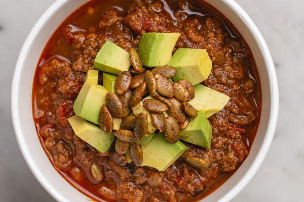 TAILGATE CHILI
 grass-fed beef, roasted tomato, avocado, chive, spiced pumpkin seeds