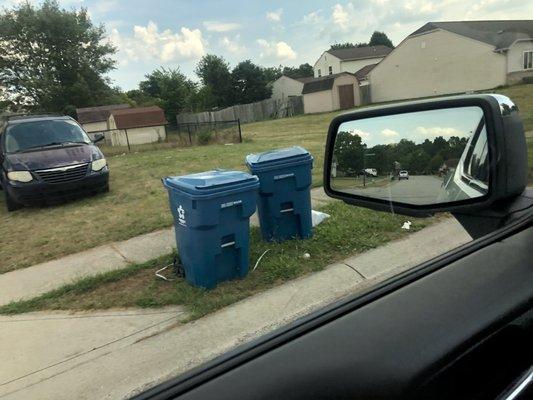 Vehicle parked next to the house in the grass for months.