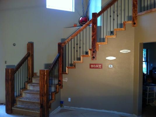 Reclaimed old growth Doug Fir stair rail with rod iron pickets