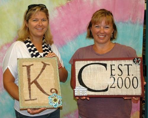 A couple of our ladies from our monthly Ladies Night with their monogrammed creations!